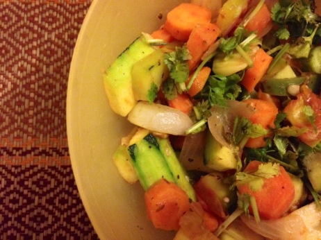 Zucchini, carrot, cucumber, onions, tomatoes, garlic, peppers with a drizzle of extra virgin olive oil, balsamic vinegar, a dash of lime, some fresh coriander, pumpkin seeds, seasoned with some super yumm Greek salad seasoning
